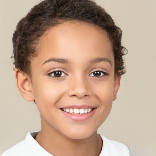 Joyful white child female with short  brown hair and brown eyes