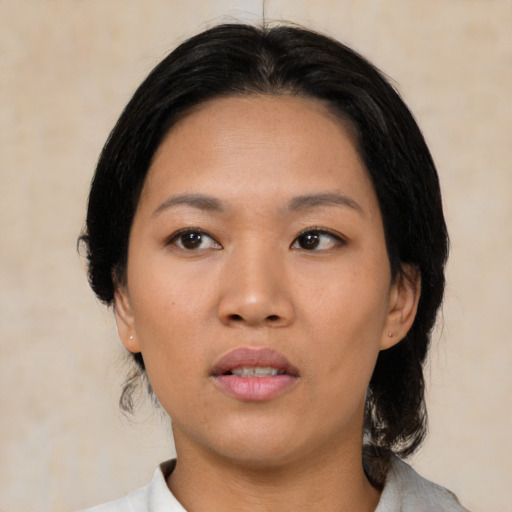 Neutral asian young-adult female with medium  black hair and brown eyes