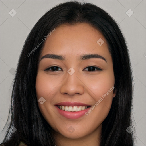 Joyful latino young-adult female with long  black hair and brown eyes