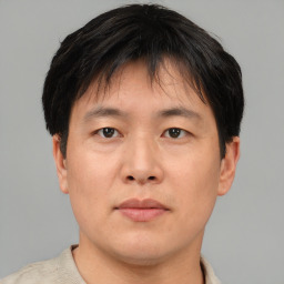 Neutral asian young-adult male with short  brown hair and brown eyes