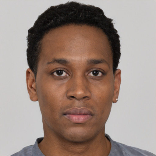 Neutral black young-adult male with short  black hair and brown eyes