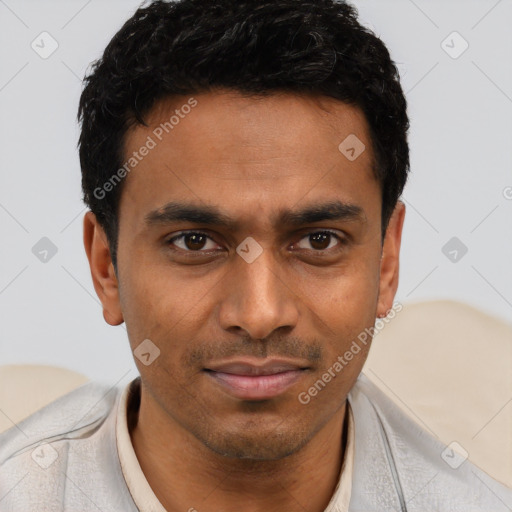Joyful latino young-adult male with short  brown hair and brown eyes