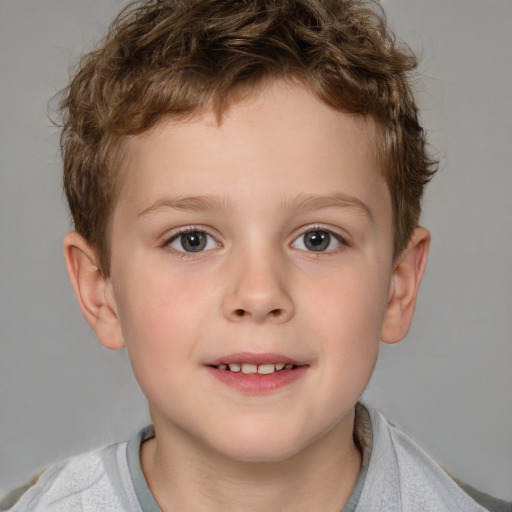 Joyful white child male with short  brown hair and brown eyes