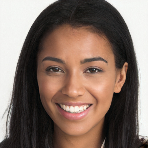 Joyful black young-adult female with long  brown hair and brown eyes