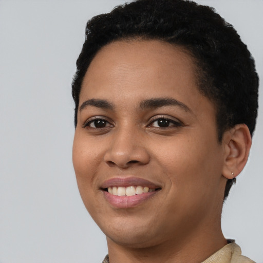 Joyful latino young-adult female with short  black hair and brown eyes