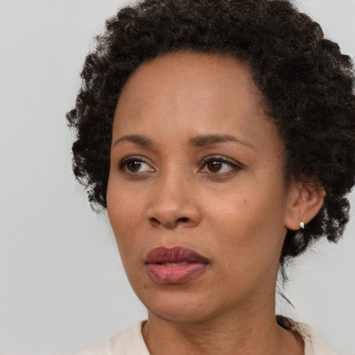 Neutral black young-adult female with short  black hair and brown eyes