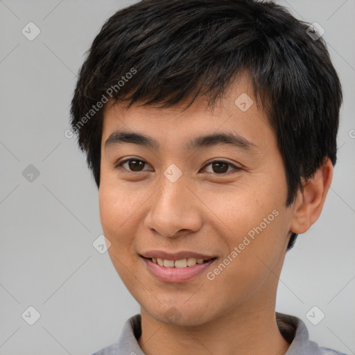 Joyful asian young-adult male with short  brown hair and brown eyes