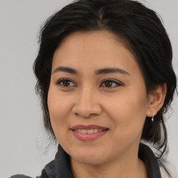 Joyful white adult female with medium  brown hair and brown eyes