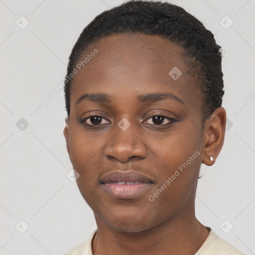 Joyful black young-adult female with short  black hair and brown eyes