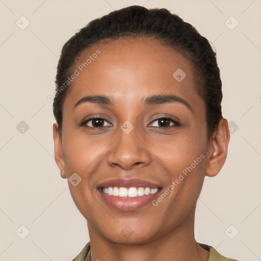 Joyful latino young-adult female with short  brown hair and brown eyes