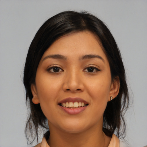 Joyful asian young-adult female with medium  brown hair and brown eyes