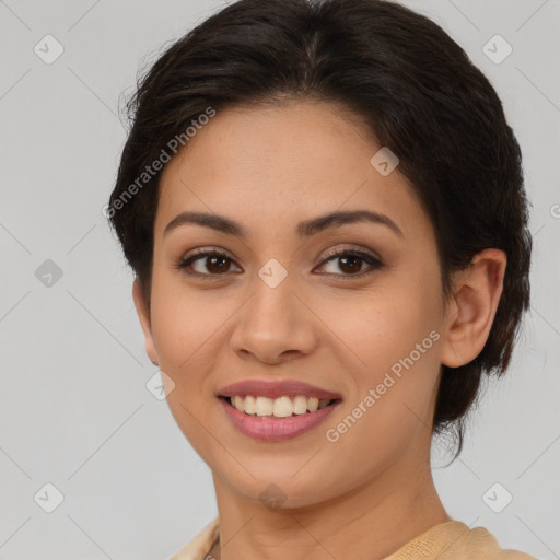 Joyful latino young-adult female with medium  brown hair and brown eyes