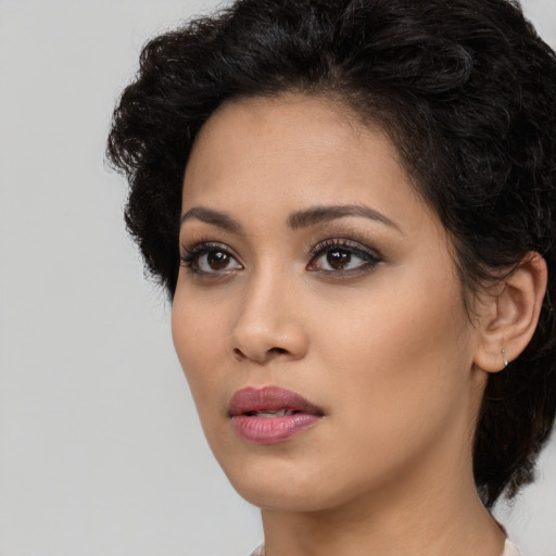 Neutral latino young-adult female with medium  black hair and brown eyes