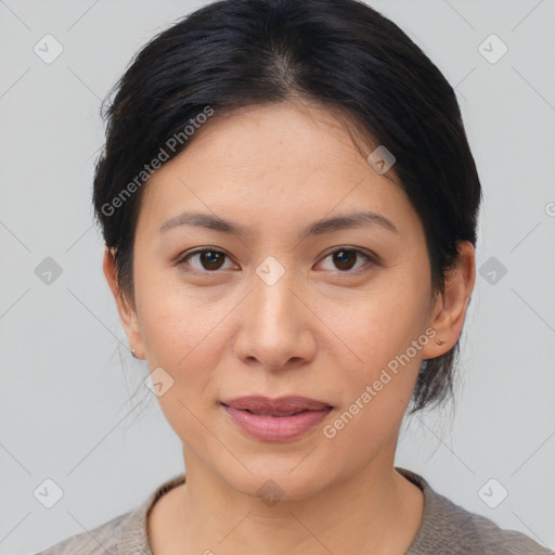 Joyful asian young-adult female with medium  brown hair and brown eyes