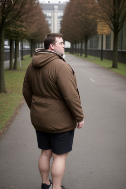 British adult male with  brown hair