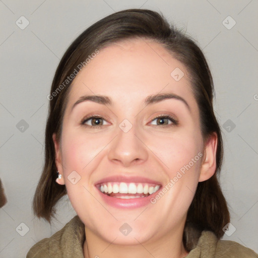 Joyful white young-adult female with medium  brown hair and grey eyes