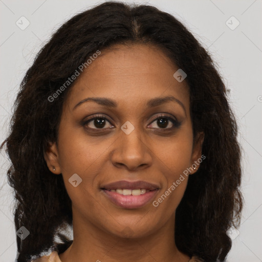 Joyful black adult female with medium  brown hair and brown eyes