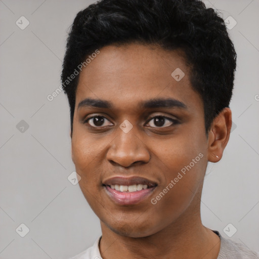 Joyful black young-adult male with short  black hair and brown eyes