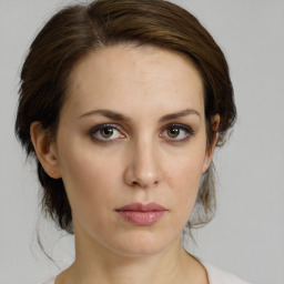 Neutral white young-adult female with medium  brown hair and brown eyes