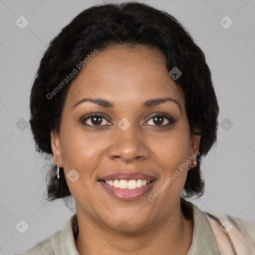 Joyful black adult female with medium  brown hair and brown eyes