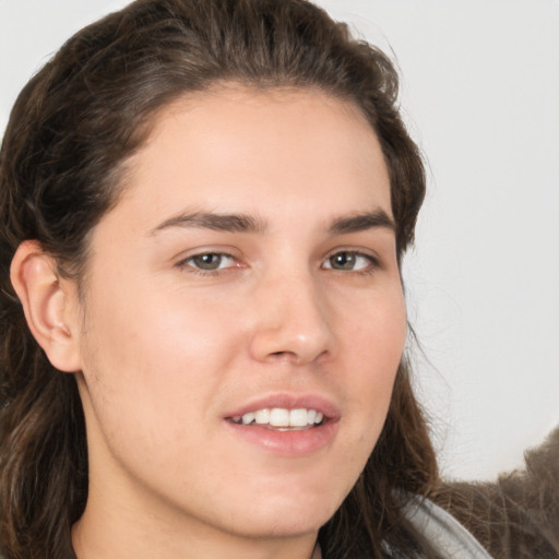 Joyful white young-adult male with medium  brown hair and brown eyes