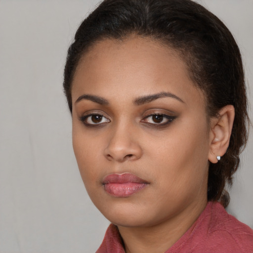 Neutral black young-adult female with long  brown hair and brown eyes