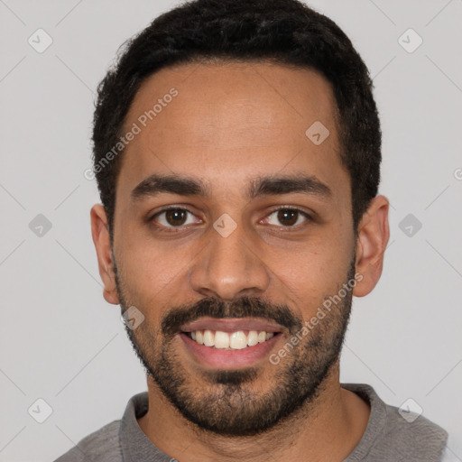 Joyful latino young-adult male with short  black hair and brown eyes