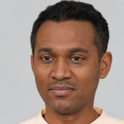 Neutral latino adult male with short  black hair and brown eyes