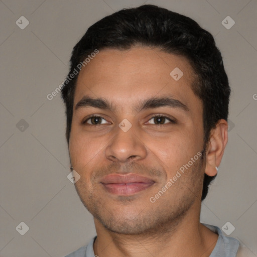 Joyful white young-adult male with short  black hair and brown eyes