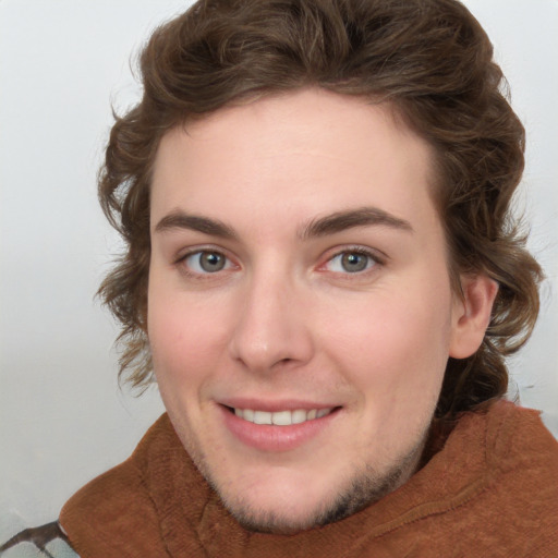 Joyful white young-adult female with medium  brown hair and green eyes