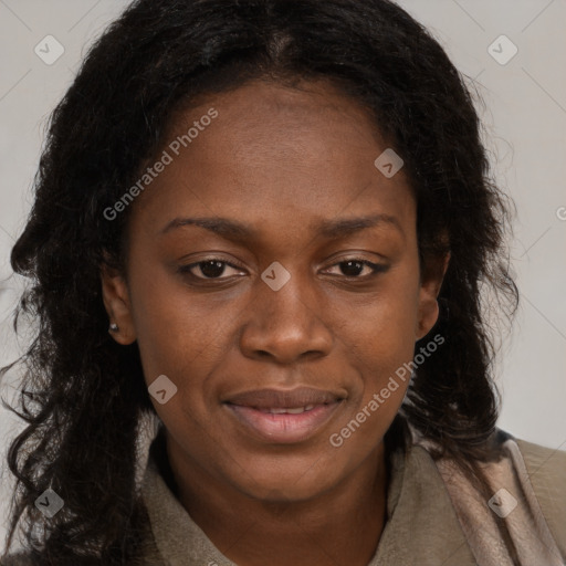 Joyful black young-adult female with long  brown hair and brown eyes