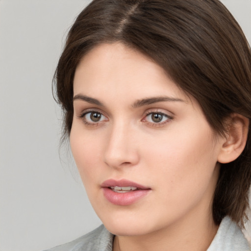 Neutral white young-adult female with medium  brown hair and brown eyes