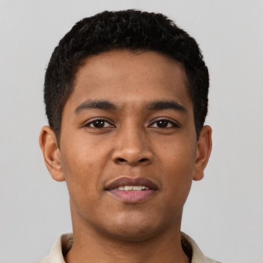 Joyful latino young-adult male with short  brown hair and brown eyes
