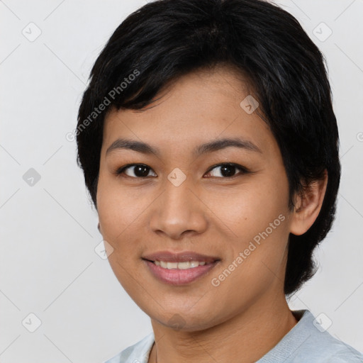 Joyful asian young-adult female with short  black hair and brown eyes