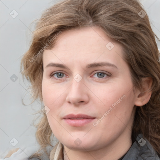 Joyful white young-adult female with medium  brown hair and blue eyes