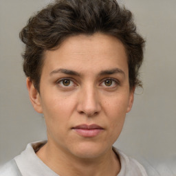 Neutral white young-adult female with short  brown hair and brown eyes