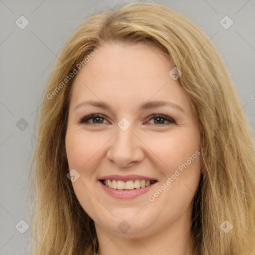 Joyful white adult female with long  brown hair and brown eyes