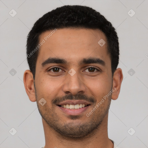 Joyful latino young-adult male with short  black hair and brown eyes