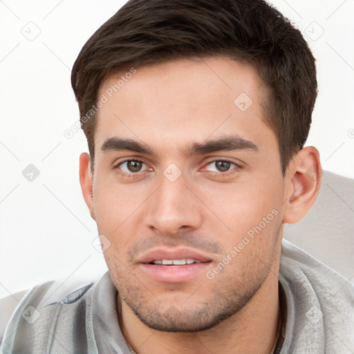 Neutral white young-adult male with short  brown hair and brown eyes