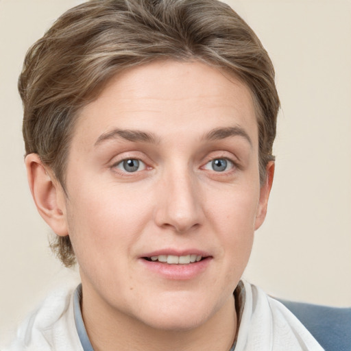 Joyful white young-adult female with short  brown hair and grey eyes