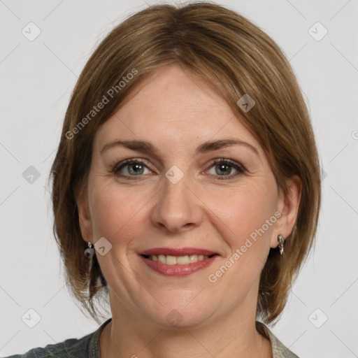 Joyful white adult female with medium  brown hair and grey eyes