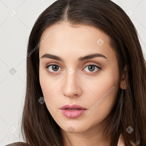 Neutral white young-adult female with long  brown hair and brown eyes