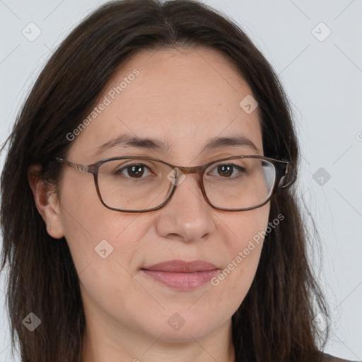 Joyful white adult female with long  brown hair and brown eyes