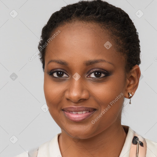 Joyful black young-adult female with short  brown hair and brown eyes