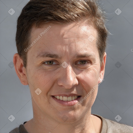 Joyful white adult male with short  brown hair and grey eyes