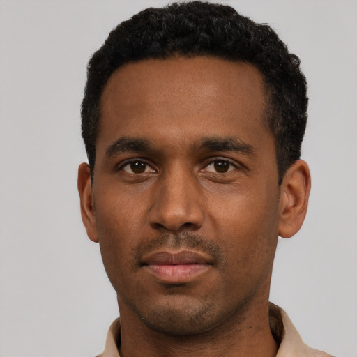 Neutral black young-adult male with short  black hair and brown eyes