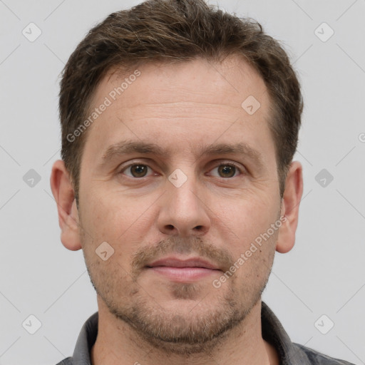 Joyful white adult male with short  brown hair and grey eyes