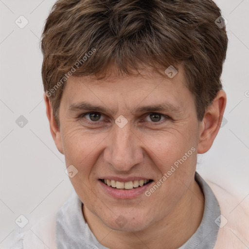 Joyful white adult male with short  brown hair and brown eyes