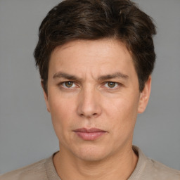 Neutral white adult male with short  brown hair and grey eyes