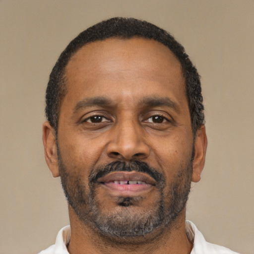 Neutral latino adult male with short  brown hair and brown eyes